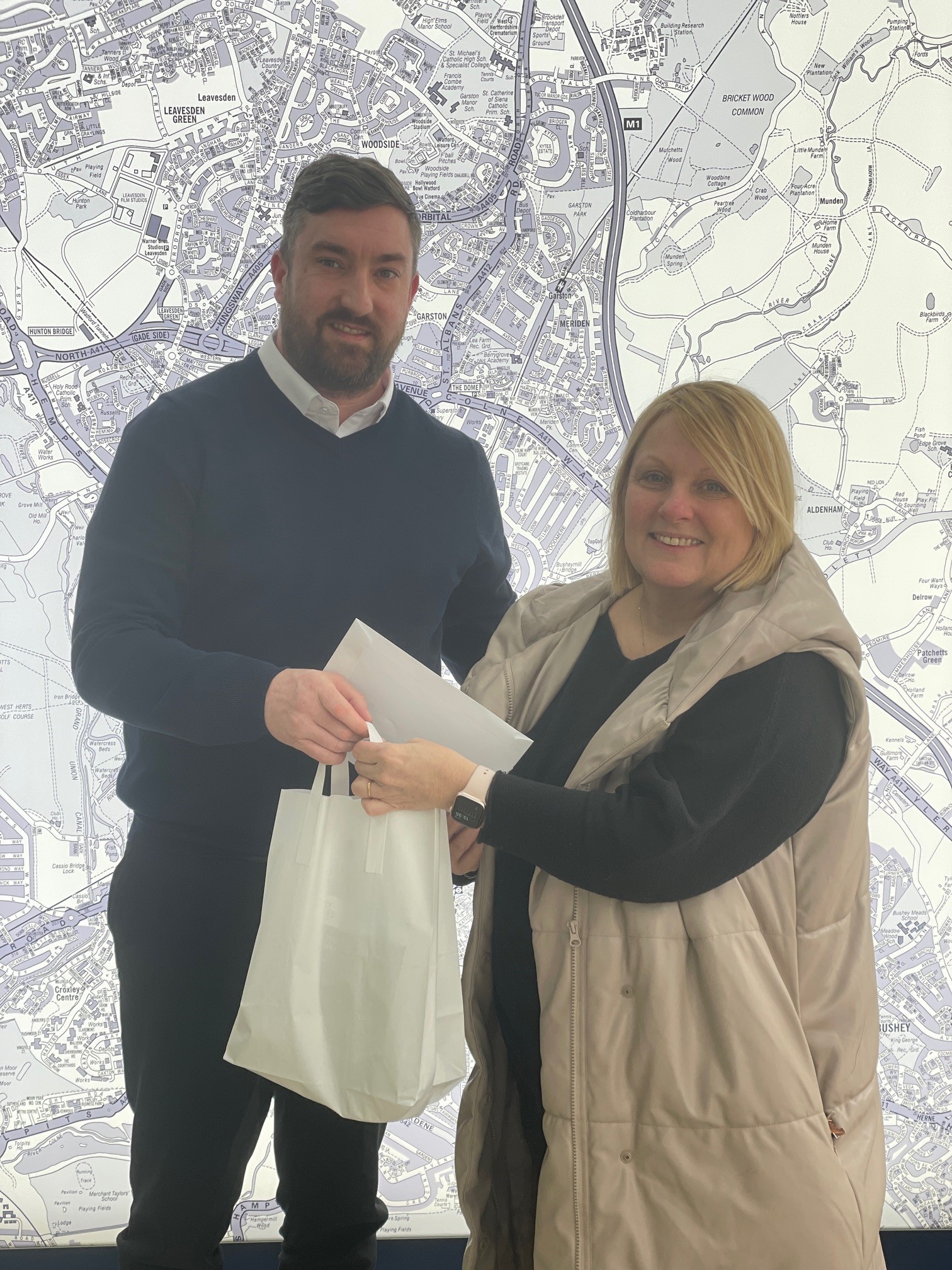 Derek passes on the keys and welcome pack to a happy buyer