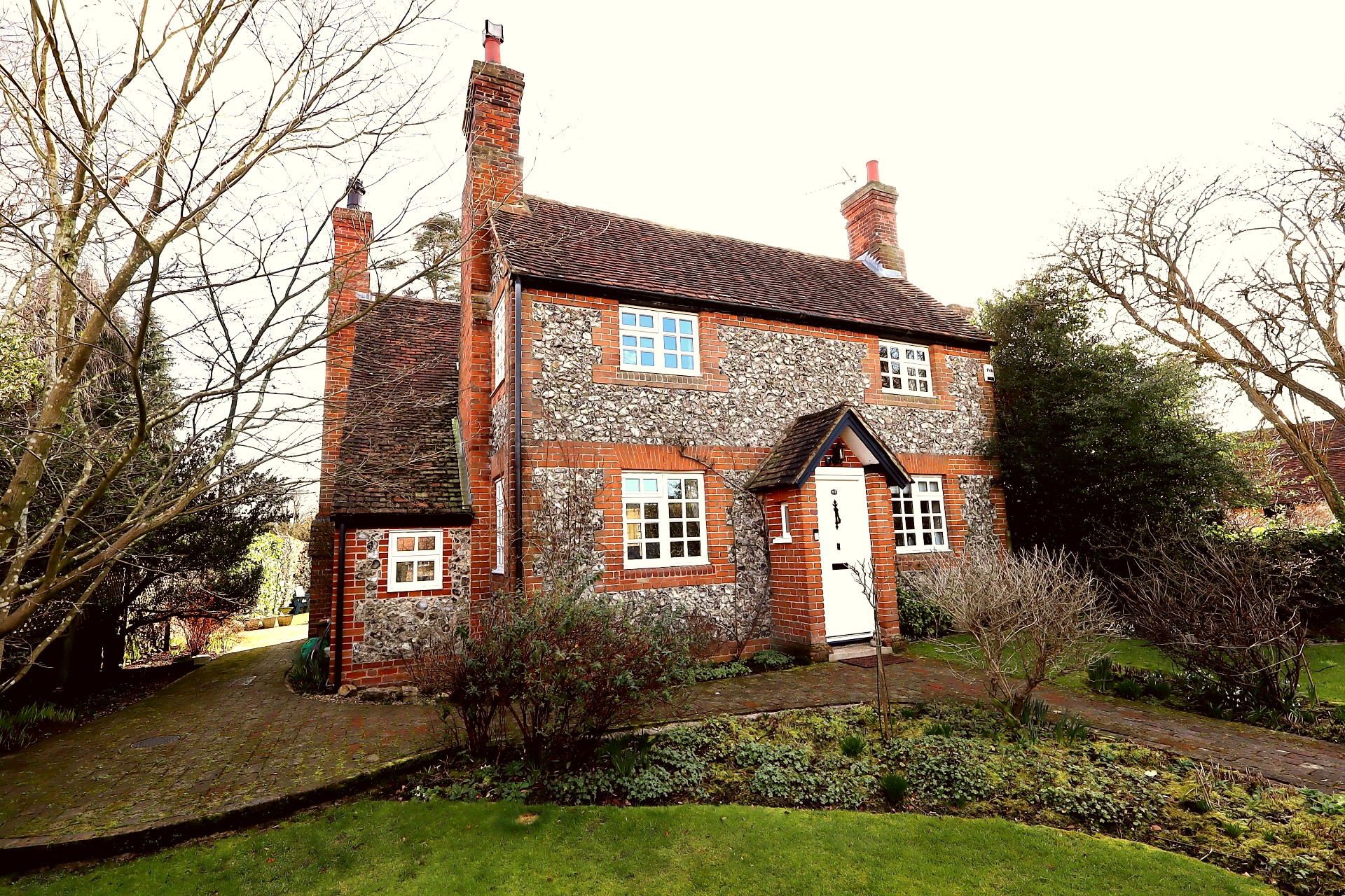 Present your front door with welcoming plants and a clean mat